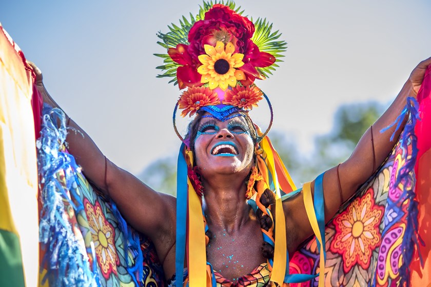 Rio de Janeiro, Brazil - February 9, 2016: Beautiful Brazilian woman of African descent wearing colourful costume and smiling during Carnaval 2016 in Rio de Janeiro, Brazil.